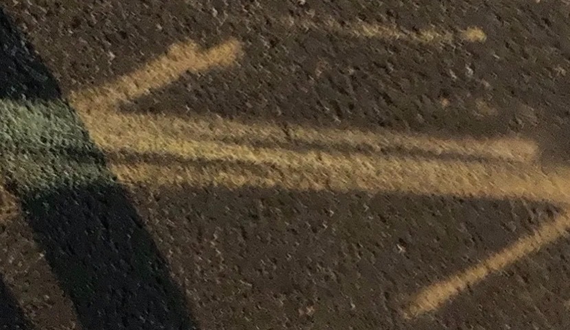 This photo is of the arrows drawn in chalk referenced in the post.  One singly headed arrow points left; the other points right.  This image suggests the set of arrows used by chemists to denote chemical equilibrium.    